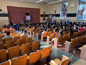  middle school students in the school's auditorium attending the Town Hall meeting 